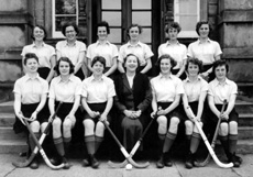 Hockey 1st XI 1955-1956. Rear: Margaret Ferguson, Elizabeth Mann, Shonaid Robertson, Helen Simpson, Marion Renfrew, Sheila Manson. Front: Betty Grant, Sheena Campbell, Jean Stoker, Miss Maude Yule, Ishbel Cameron, Pat Urquhart, Pat Cumming. (Courtesy Inverness Royal Academy Archive IRAA_108).