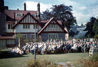 Opening of the new Carrol House Orphanage, Island Bank Road, Inverness. The Carrol House Orphanage was officially opened at 3.00pm on Wednesday 26th August 1959 by Lady Maud Baillie CBE. Eighteen children, cared for by the Highland Orphanage Trust, moved from the old building in Culduthel Road a few weeks previously and settled in to the more compact and up-to-date premises. Robert Gilbert, chairman of the Board of Governors presided at the well-attended ceremony, which was also addressed by Provost Robert Wotherspoon. The matron was Mrs M. Maclean and the two house-mothers were Miss I. Ross and Miss N. Donaldson. A bouquet was presented to Lady Baillie by Heather la Freniere, one of the children in the home. (Courtesy James S Nairn Colour Collection). ~