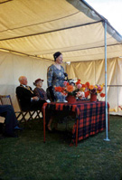 Opening of the new Carrol House Orphanage, Island Bank Road, Inverness. The Carrol House Orphanage was officially opened at 3.00pm on Wednesday 26th August 1959 by Lady Maud Baillie CBE (shown speaking here). Eighteen children, cared for by the Highland Orphanage Trust, moved from the old building in Culduthel Road a few weeks previously and settled in to the more compact and up-to-date premises. Robert Gilbert, chairman of the Board of Governors presided at the well-attended ceremony, which was also addressed by Provost Robert Wotherspoon. The matron was Mrs M. Maclean and the two house-mothers were Miss I. Ross and Miss N. Donaldson. A bouquet was presented to Lady Baillie by Heather la Freniere, one of the children in the home. (Courtesy James S Nairn Colour Collection). ~