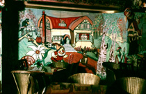 Playhouse Cinema foyer and restaurant, Christmas 1957. Every Christmas season, James Nairn, photographer and manager of the Playhouse, would decorate the foyer and cafe with hand painted cartoon and Disney themes to the delight of visiting children. The Playhouse Cinema was destroyed by fire in 1972, and sadly James Nairn lost the bulk of his photographic and memorabilia archives. (Courtesy James S Nairn Colour Collection). ~ *