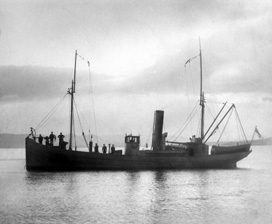 The fishing drifter Clans of Macduff was used as an armed naval auxiliary during the First World War. She was built in 1915 and requisitioned by the Admiralty for wartime service in June. Returned to the owners in 1919 she was again requisitioned for service in August 1939 until April 1945 as a Harbour Service Vessel. In this photo the crew are wearing uniform and she is flying the White Ensign. Submitted by Robert Paterson.*