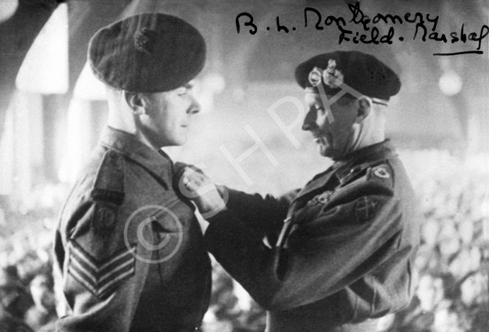 Copy of a photograph for Mrs Mackenzie showing Field Marshal Bernard Law Montgomery awarding a medal.....