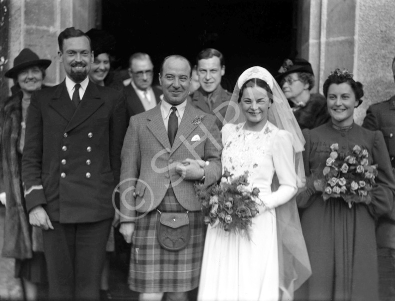 Hamish Paterson (1904-1982), Chartered Architect based at 17 Queensgate, Inverness, married Florence Margaret Ross (1909-1987) in 1940. (see also 24194a and 24194b). Hamish had a twin brother called Hector Paterson (see image ref: 37284). Bridesmaid is bride's sister Joyce Ross. At far left is groom's mother, Jenny Paterson. Hamish was the son of famous photographer Andrew Paterson (1877-1948). 