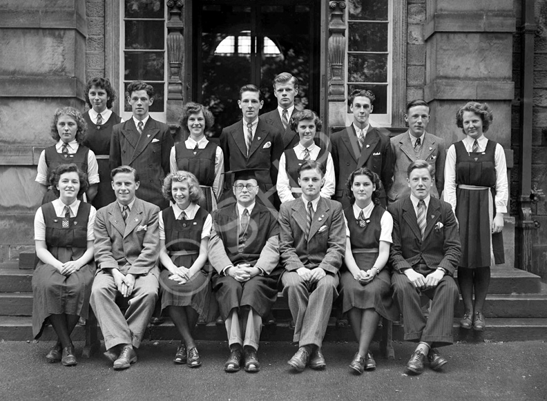 Inverness Royal Academy Prefects 1948-1949. Rear: Peggy MacLeod, Margaret MacLennan, Roderick A. MacLeod, Peggy Fraser, Stanley Fleming, James MacKenzie, Deirdre Munro, Frank Taylor, Ross Martin, Aileen Munro. Front: Erica Donald, Scott Moffatt (VC), Aileen Barr (C), Rector D.J MacDonald, Allan Cameron (C), Lorna Menzies (VC), Angus MacKenzie. See also IRAA_045.