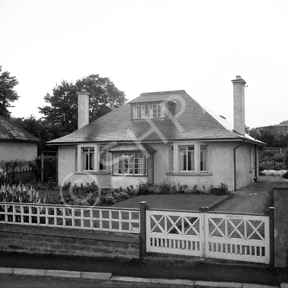 House called Roseville on Cromlet Drive, Invergordon, with a large fuel tank in the right background. *