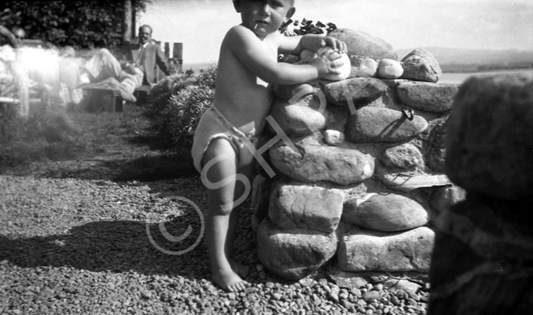 George Maclennan (1920-2001) on the beach at North Kessock c1924. He was a nephew of the famous photographer Andrew Paterson (1877-1948). In the background is Hector Paterson, son of Andrew Paterson. #