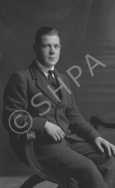 Young man seated.#