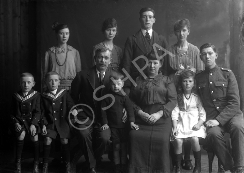 Allison family group c.1920. Rear from left, Margaret Allison (age 15), Maurie Allison (21), William 'Bill' Lumsden Allison (20), Isabella 'Ella' Allison (18). Front row; twins Murdo and Alastair Allison (8), father William Allison (38), Donald 'Donnie' Allison (5), mother Annie Lumsden (36), Helen Allison (9) and John Allison (16).   Bill Allison emigrated to America where he married Dorothy Paterson in 1930, the daughter of Peter Paterson of Inverness. A master baker and one time president of the Caledonian Football Club, Peter was a brother of famous photographer Andrew Paterson.