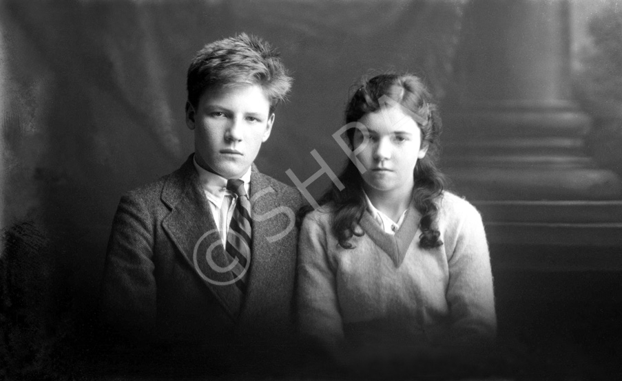 Miss Dorothy Paterson, Kenneth Street, Inverness. The young man on the left is James Daniel Mackintosh (1905-1970), son of James Daniel Mackintosh (1867-1909) and Christina Christie (1877-1913). When his parents died, he and his younger sister Maisie were taken in at different times by several different relatives, including his mother's sister Anne, who had married Peter Paterson. He is with the Paterson's adopted daughter Dorothy (1906-1967). James Daniel Mackintosh emigrated to the USA in 1923, after Maisie died in 1920. Peter Paterson was the brother of famous photographer Andrew Paterson (1877-1948), who also emigrated with wife Anne and daughter Dorothy in 1925. 
