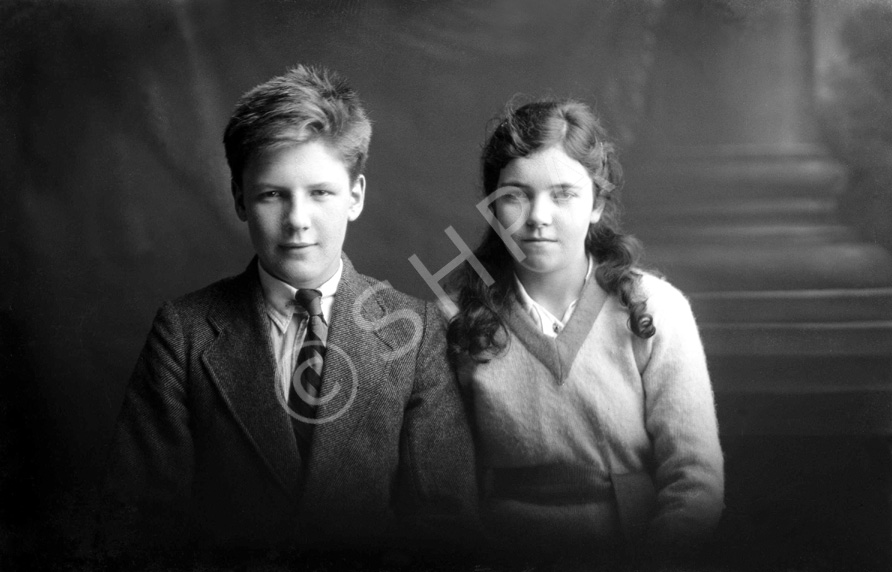 Miss Dorothy Paterson, Kenneth Street, Inverness. The young man on the left is James Daniel Mackintosh (1905-1970), son of James Daniel Mackintosh (1867-1909) and Christina Christie (1877-1913). When his parents died, he and his younger sister Maisie were taken in at different times by several different relatives, including his mother's sister Anne, who had married Peter Paterson. He is with the Paterson's adopted daughter Dorothy (1906-1967). James Daniel Mackintosh emigrated to the USA in 1923, after Maisie died in 1920. Peter Paterson was the brother of famous photographer Andrew Paterson (1877-1948), who also emigrated with wife Anne and daughter Dorothy in 1925. 