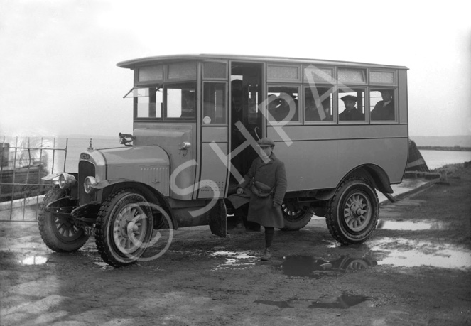 The Ferry Omnibus. Owned by Mr W. Greig, the 1921 Vulcan (ST1410) was the first bus in Inverness with pneumatic tyres. A note on the side panel indicates its speed was 12 mph. The standing conductor is M. Greig. * 
