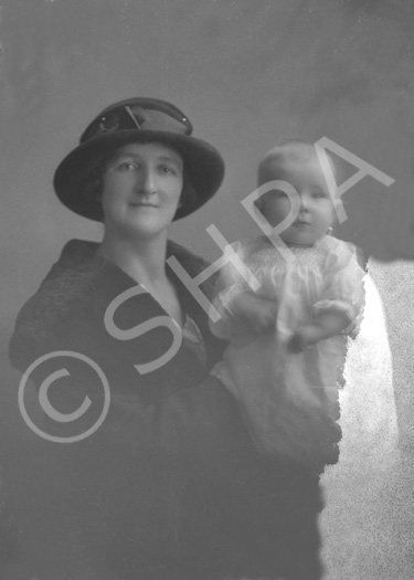 Mrs MacKinnon with baby, Braeside, North Kessock, Inverness. (Damaged plate)    .....