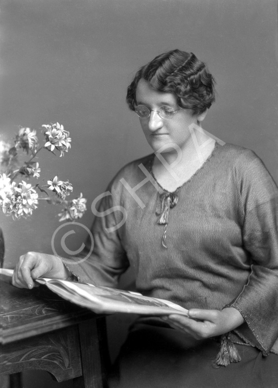 Woman reading magazine. #