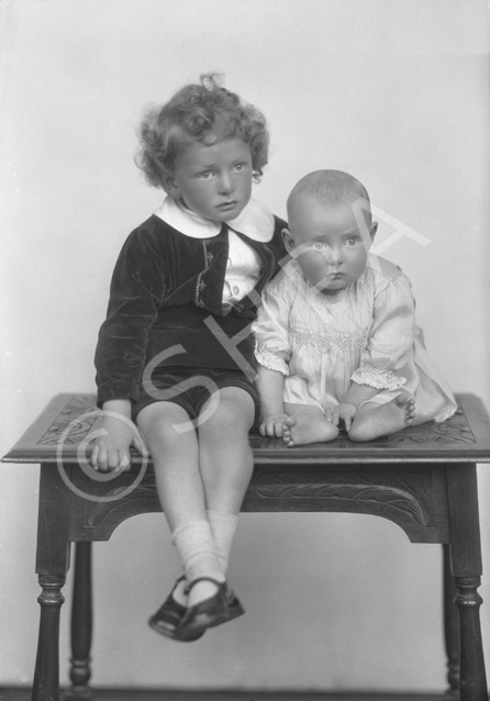 Grant, young boy and baby on table......
