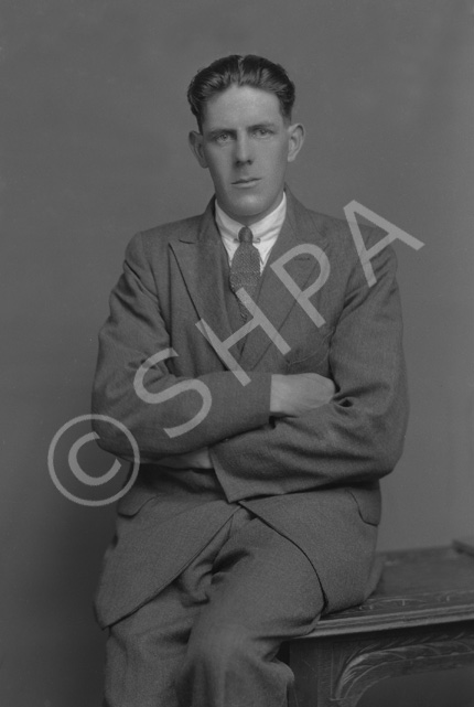 W. MacLean, with arms folded......