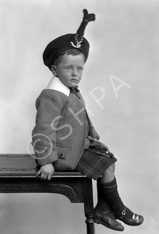 Young boy in Scottish dress.#   