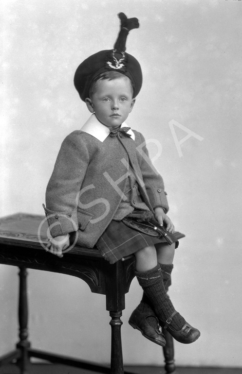 Young boy in Scottish dress.#