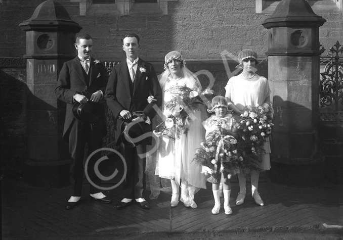 Sinclair - Sutherland bridal group outside Ness Bank Church. The stone plinths still remain after recent renovations to comply with the requirements of the Disability Discrimination Act for access to the Church.