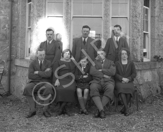 Miss MacDonald, Whitebridge. May 1928. The men have dark diamond shapes sewed onto their left sleeves. The man at the top left has been isolated to make a new solo photo. 