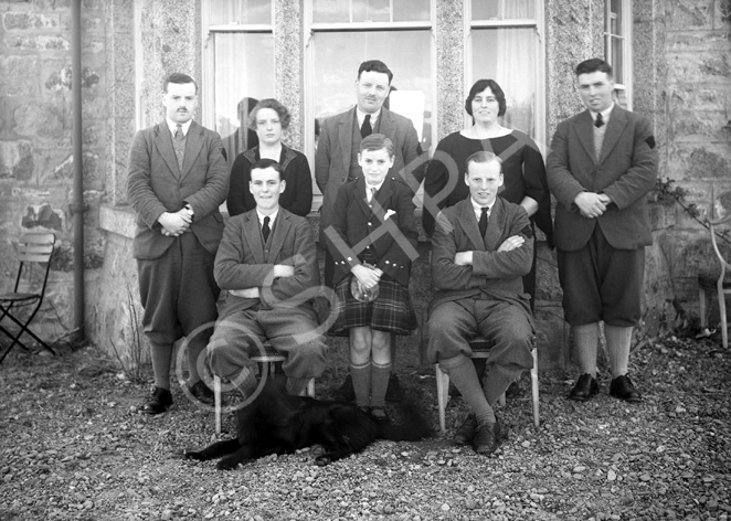 Miss MacDonald, Whitebridge. May 1928. The men have dark diamond shapes sewed onto their left sleeves.