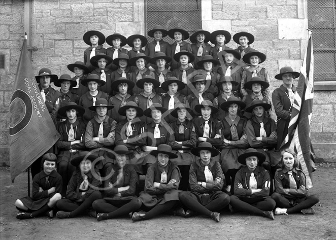 Inverness Royal Academy Girl Guide Company, photographed in 1927 for use in the school magazine published that June. The same photograph was later used in the People's Journal. At this time the Company Captain was Miss Mary Roy (geography teacher), and Miss Jessie Horne (art) had recently become Lieutenant. Weekly meetings were held in the school gymnasium. The Company was established in about 1923, and ran until the early 1940s. The flag reads: '3rd Inverness Royal Academy.' #