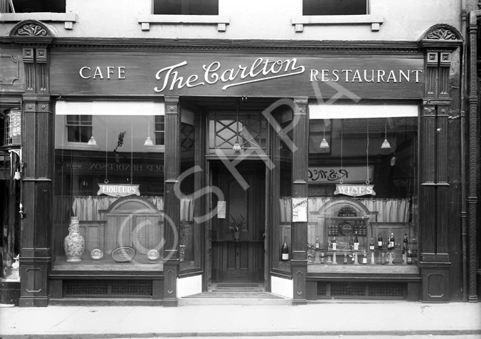 The Carlton Cafe, Inglis Street, Inverness, now occupied by Costa Coffee. The reflection in right window shows the storefront of R.S.McColl, now occupied by Highland Souvenirs.* 