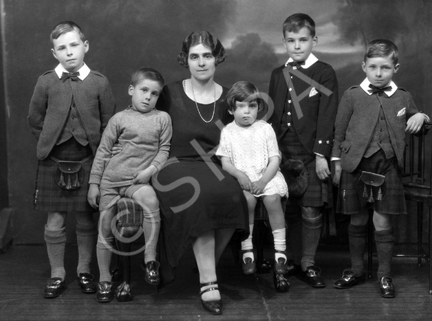 Jessie Macleod (nee Macrae) with Colin, Lorne, Duncan, Dodo and Ishbel. Jessie was a stage actress (see 26822b - the 1927 production of 'The Geisha'). Her husband was Colin Macleod. This family portrait was taken c1925. The boy Colin Macleod served during WWII in the Royal Navy. After being de-mobbed in 1946, he joined the merchant navy, where he rose to the rank of captain. During the early 1960s, he left the service and became Harbour Master at Inverness. He held this position for several years before re-joining the merchant navy. Lorne Macleod became a dentist and had his own practice in Huntly Street until he emigrated to Australia in 1967. Duncan Macleod also became a dentist with a practice in Boness and later Edinburgh. Donald 'Dodo' Macleod remained in Inverness and played football in his younger days for Inverness Thistle Football Club. Information kindly provided by Jessie's grandson Duncan Phillips.