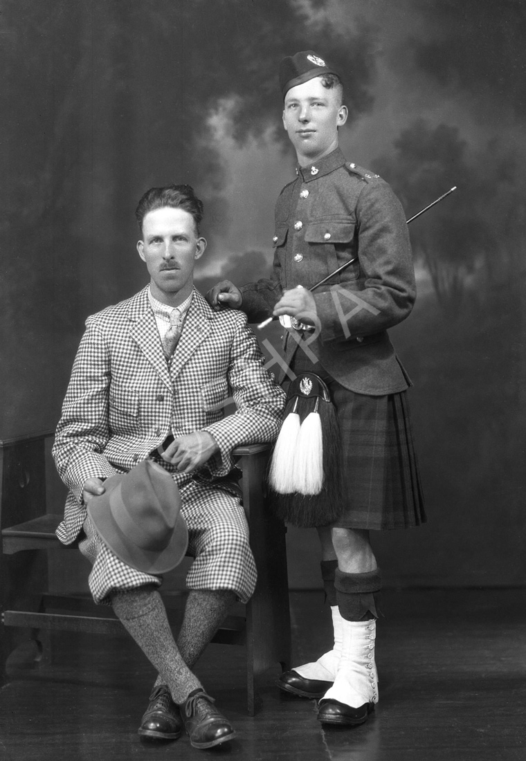 Two men, one in soldier uniform of the Cameron Highlanders.#