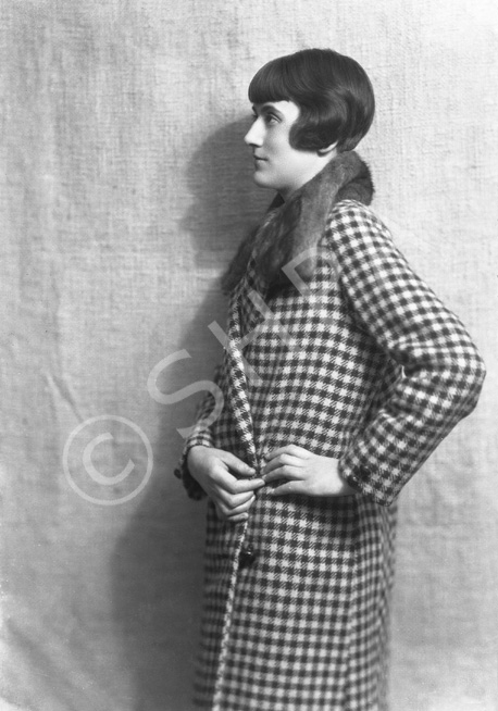 Woman in fur collar, check pattern coat.#