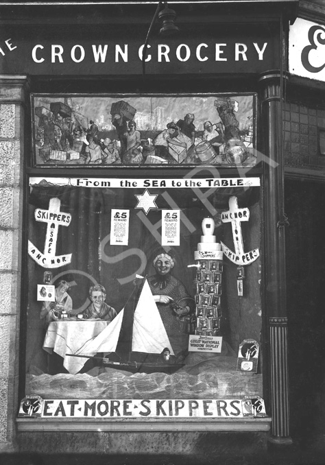 Ettles Crown Grocery, Inverness December 1927.  Window display for Skippers tinned fish, an entrant in the John Bull's Great National Window Display competition. Now Chris Crook Hairdressers on the corner of Charles Street, Inverness.* 