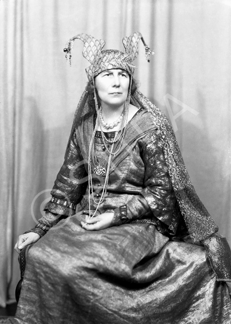 Actress Nelly Hutin Britton was born on 24th April 1876 in Bucklebury, Berkshire. Famous for her Shakespearean roles, she debuted in 1901 in 'Henry V.' She also played Hero in 'Much Ado About Nothing' (1903), Ophelia in 'Hamlet' (1909), Lady Elizabeth in 'Richard III' (1909) and Lady Macbeth at Stratford (1911). In 1903 she married famous actor Matheson Lang, and thereafter they appeared together frequently on stage and later on film. In 1906 she played Arganthael in 'Tristram and Iseult' at the Adelphi Theatre, with Lang as Tristram. Britton and Lang subsequently formed their own company, which toured India, South Africa and Australia from 1910-13 performing Shakespeare. Her roles included Katherine in 'The Taming of the Shrew,' Portia in 'The Merchant of Venice,' Juliet in 'Romeo and Juliet,' as well as reprising the roles of Ophelia and Lady Macbeth. She also appeared with Lang in 'Mr Wu,' which became his signature role. In 1916 they appeared together in a silent film of 'The Merchant of Venice' in which she once again played Portia. She also joined her husband in the film 'The Wandering Jew' (1923) playing the part of Judith. After a four-year illness and a temporary retirement, she returned to the Old Vic stage in 1923 for the Shakespeare Birthday Festival and the following year as Volumnia in 'Coriolanus,' and continued to act until she retired in 1936. In 1940 the Langs were staying with their old friend Dornford Yates and his wife at their house near Pau in France when France surrendered, and they had to escape from the advancing Germans through Spain to Portugal. In later life she sat on the governing board of the Old Vic Theatre. She died on 3rd September 1965 aged 89. These promotional shots were probably taken for the Inverness performance of 'The Wandering Jew' in October 1936, which played to a packed house for several days at the Empire Theatre.