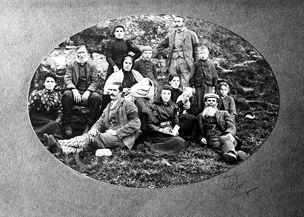 Mr MacAskill, North Kessock. Group outdoors. Two men are wearing black armbands, so could be taken before or after a funeral.