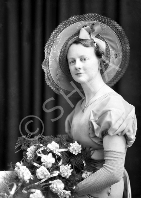 Miss MacKinnon. She was a bridesmaid in the unidentified image 30556......