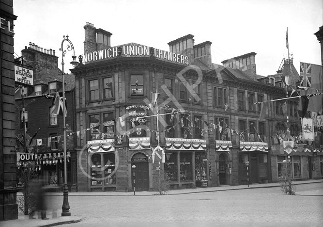 The Norwich Union building, Union Street, Inverness, bedecked with King George VI Coronation decorations, May 1937. Photo taken from Station Square, the first floor signage today reads Norwich Union-Scottish Union Insurance Group. The corner florist on the ground floor is now Santander.* 