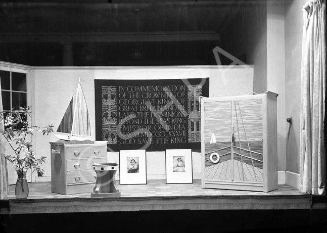 Mr MacAvoy's show window for the May 1937 Coronation of King George VI, complete with portraits of the Princesses Elizabeth and Margaret, and sailing motifs.* 