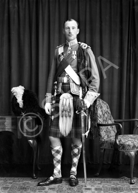 Captain E. Grant MC, Nairn. Seaforth Highlanders.  Later Brigadier, Eneas Grant was born in 1901, and belonged to a family which served in the Seaforth Highlanders for four generations. He served in the regiment from 1920 to 1955, when he retired to his house and hill farm at Tomatin. Both his sons joined the Seaforth, the elder being killed in action in Korea in 1951 (see ref no. 542). The supplement to the London Gazette of October 1945 announced 'The KING has been graciously pleased to approve the following awards in recognition of gallant and distinguished services in North-West Europe: Brigadier (acting) Eneas Henry George GRANT, D.S.O., M.C. (18829), The Seaforth Highlanders (Ross-shire Buffs, The Duke of Albany's) (Tomatin, Inverness).' An un-dated newspaper cutting from 1951 is filed with the negatives. It announces his being awarded a C.B.E. and states: 'Brigadier (Temporary) Eneas Henry George Grant, D.S.O, M.C., late Infantry. Brigadier Grant is the only surviving son of the late Col. H.G. Grant and of Mrs I. Grant, Balnespick, Tomatin, and his house is at Auchenfroe, Nairn. He was awarded the M.C. when serving with his regiment, The Seaforth Highlanders, in Palestine in 1936, and won the D.S.O. in 1944, gaining a Bar to it in 1945.' See also ref no. 43823a-j.  