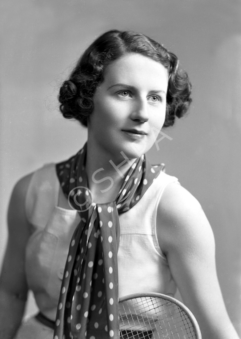 Miss Jean Chisholm. Colour tint instructions and lock of hair inside envelope. Eyes blue-grey, scarf red with white spots and red belt. 