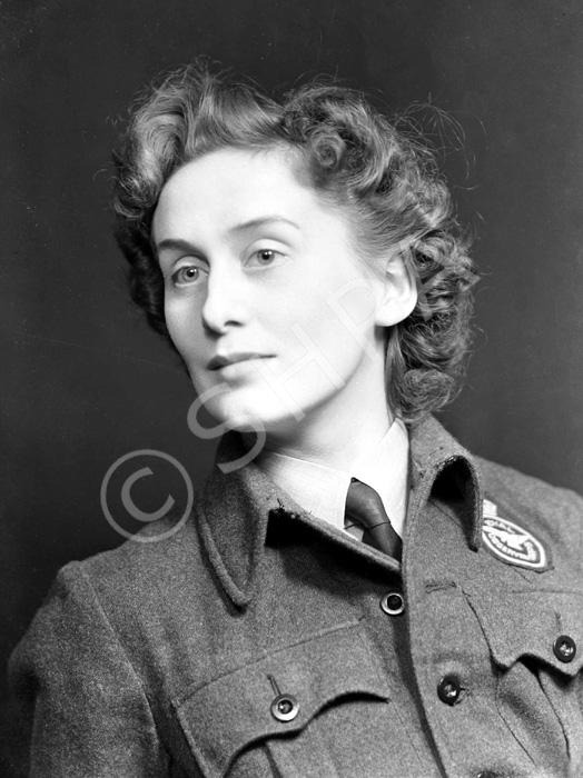 Miss MacDonald, 27 Telford Gardens. She is wearing the badge of the Royal Observer Corps.