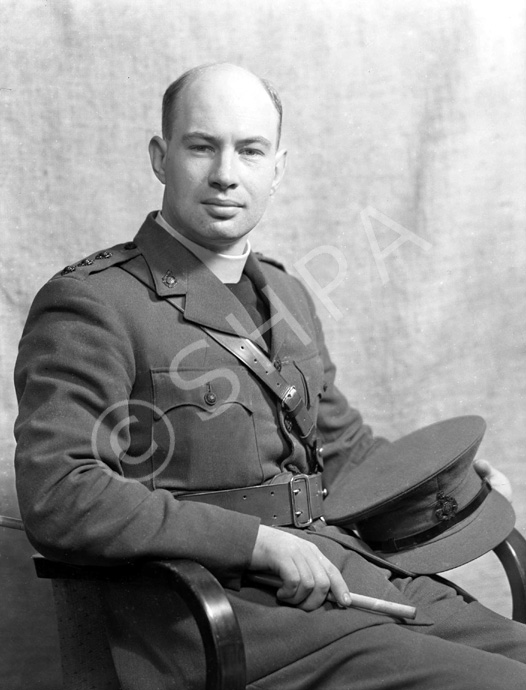 Rev James Fraser CF. The cap badge denotes the Royal Army Chaplains Department. .....