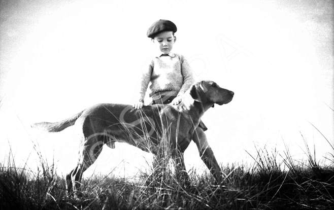 Andrew Chalmers with his pet dog. He was a grandson of the famous photographer Andrew Paterson (1877-1948).