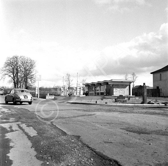 National petrol station, under the name Macbeath, C.A. Academy Street. Location is on Old Perth Road, now the Kingswell Service Station. To the right is a police phone box. *