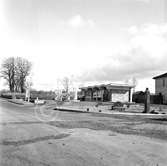 National petrol station, under the name Macbeath, C.A. Academy Street. Location is on Old Perth Road, now the Kingswell Service Station. To the right is a police phone box. *