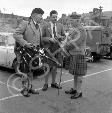Matheson (on right) talking with pipers in the car park of what is now Farraline Park Bus Station, Inverness.
