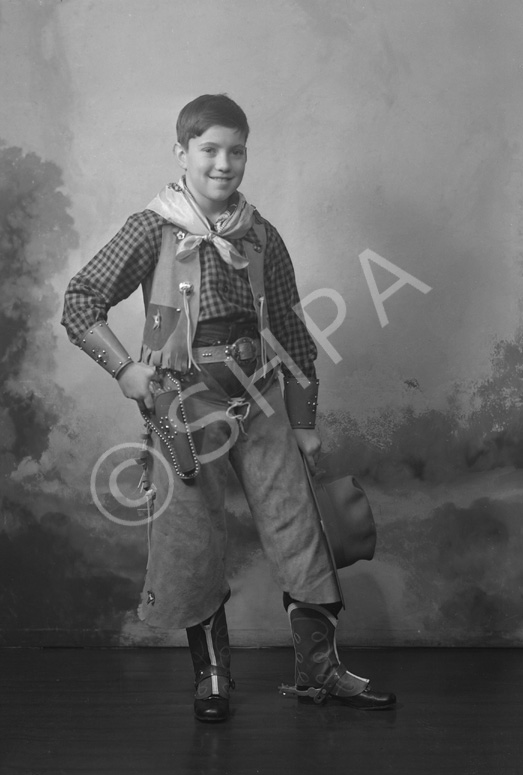 Andrew Chalmers dressed in a cowboy costume for a fancy dress party c1947. (see also refs: 33898, 39550 and 45474). He was a grandson of the famous photographer Andrew Paterson (1877-1948).