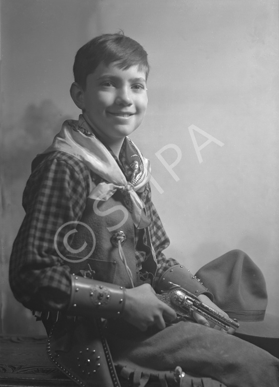 Andrew Chalmers dressed in a cowboy costume for a fancy dress party c1947. (see also refs: 33898, 39.....