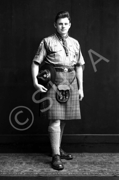 James Grant, probably a member of 3rd Inverness (Crown) Scout Troop. He is wearing a badge dated 1958 (for the Patrol Jamborette held at Blair Atholl in that year), and the other badges he is wearing indicate he was well through the Scout training programme. In his hat he has the badges which indicate that he was a patrol leader.