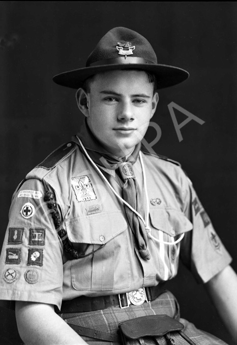 James Grant, probably a member of 3rd Inverness (Crown) Scout Troop. He is wearing a badge dated 1958 (for the Patrol Jamborette held at Blair Atholl in that year), and the other badges he is wearing indicate he was well through the Scout training programme. In his hat he has the badges which indicate that he was a patrol leader.