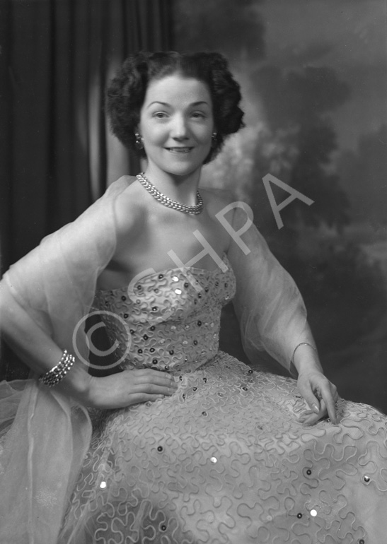 Miss Cairns, Station Hotel, Inverness, in ball gown, seated. Other images also under code 42904.