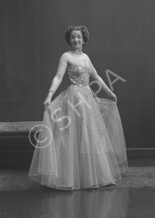 Miss Cairns, Station Hotel, Inverness, in ball gown, standing. Other images also under code 42904.