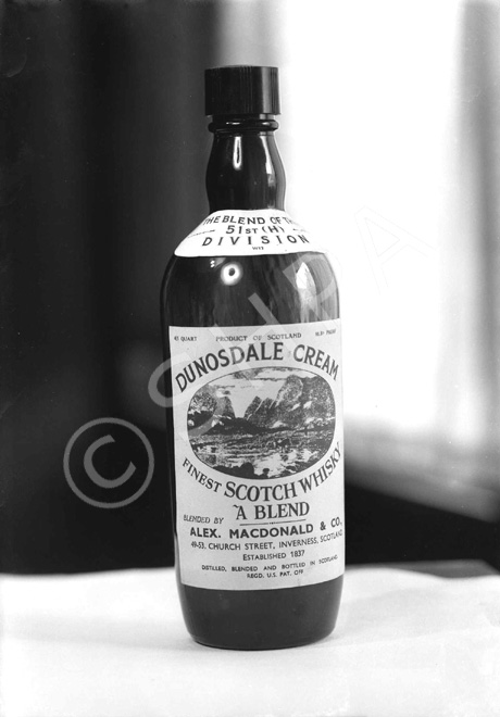 Messrs Alexander MacDonald & Co, Wine Merchants, 49-53 Church Street, Inverness (established 1837). A  bottle of their Dunosdale Cream blended whisky, 'The Blend of the 51st (H) Division.'* 